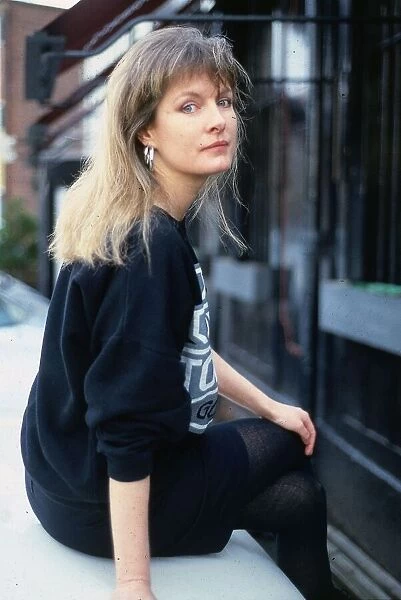 Susan Wooldridge sitting on wall January 1988