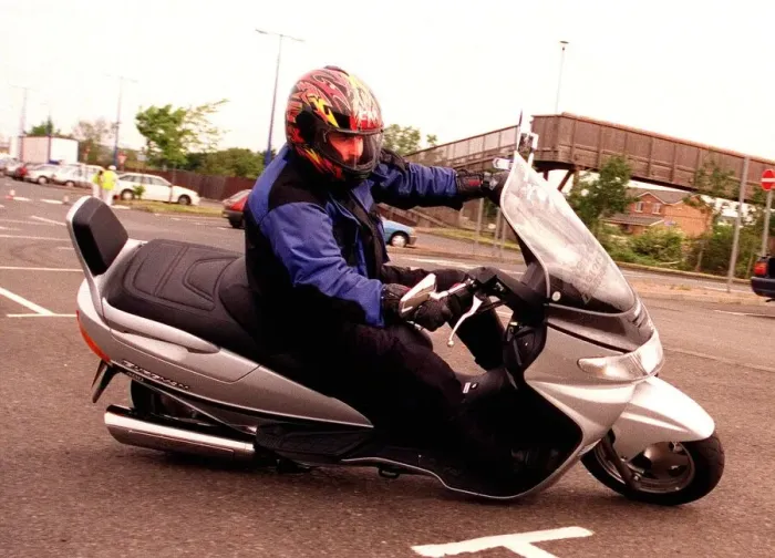 Framed Print : Suzuki Burgman 400 motorbike June 1999 being driven round corner