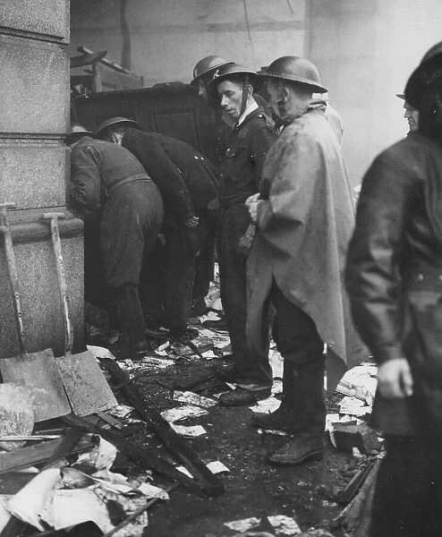 Swansea blitz - A rescue squad looking for burned people in a shelter. June 1941