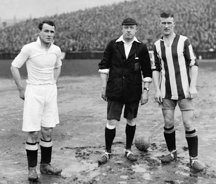 Framed Print : Swansea v Stoke FA Cup Tie. Joe Sykes of Swansea with referee P Harper Framed Print : Swansea v Stoke FA Cup Tie. Joe Sykes of Swansea with referee P Harper