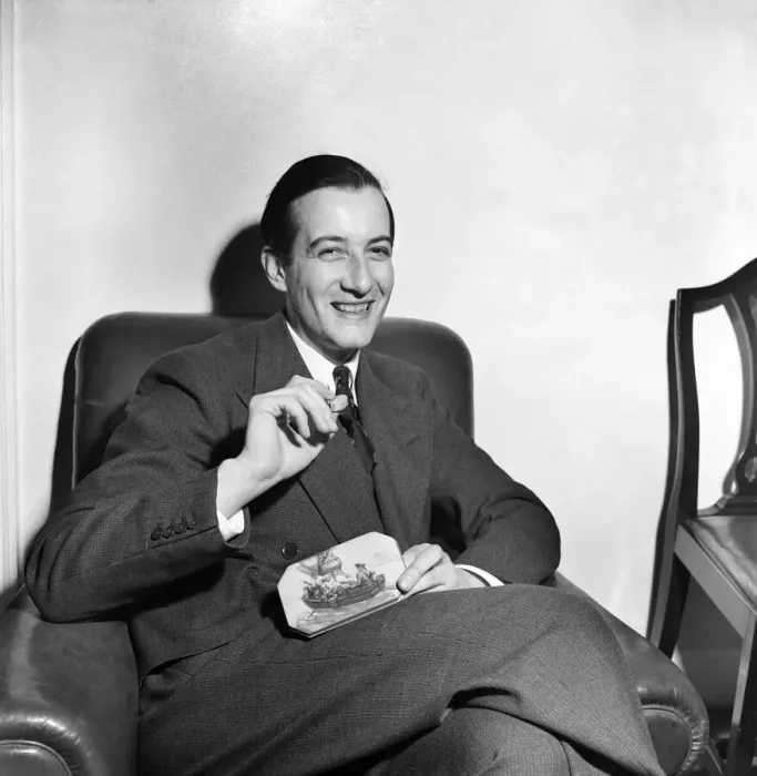 Framed Print : Sweets Salesman Kenneth Horner showing some of his product Framed Print : Sweets Salesman Kenneth Horner showing some of his product