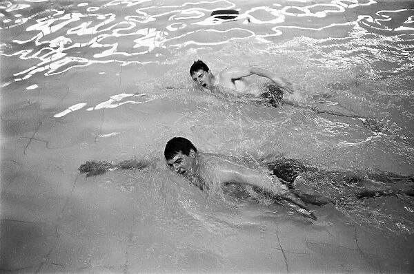 Swimmer Bobby Lord (top of picture) training with coach Graham Symonds. 8th November 1965