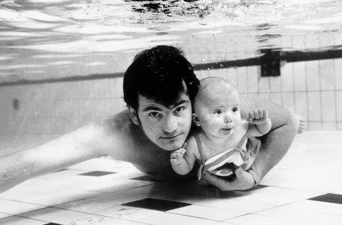 Framed Print : Swimming Underwater baby Tracey four months old with father Steve Appleby