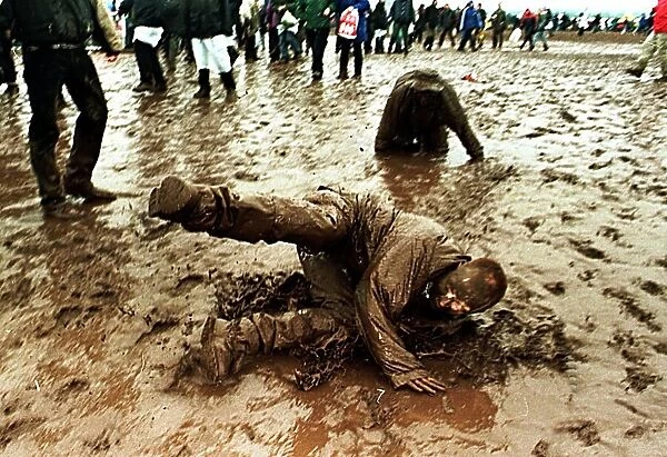 T in the Park Concert in Balado, Scotland July 1998 Festival goers covered in mud