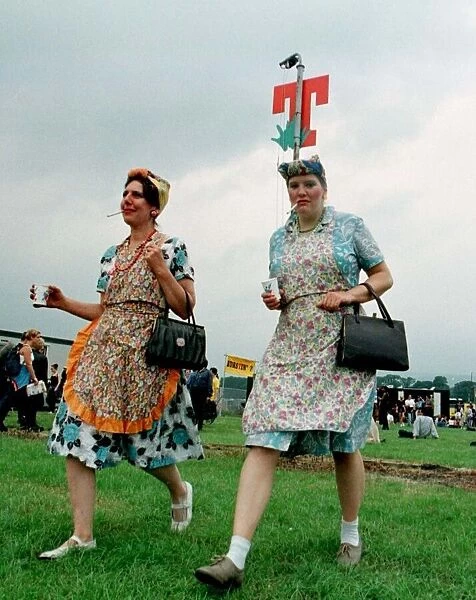 T In the Park July 1997 two girl fans dresses up as tea ladies