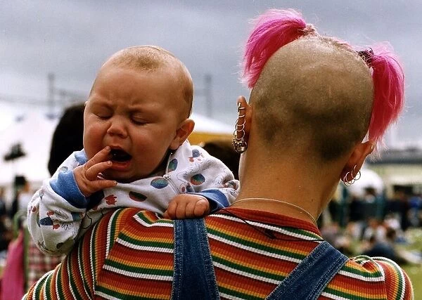 T in the Park Music Festival fan with yawning baby