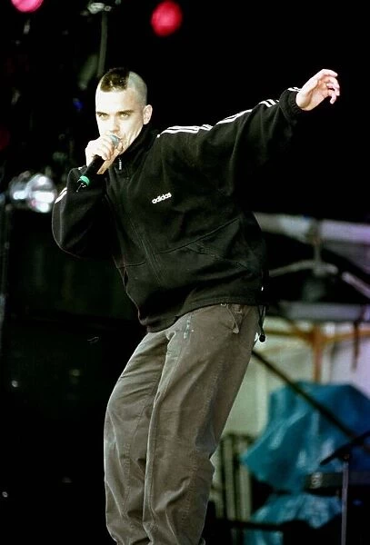 T in the Park Robbie Williams on stage singing July 1998