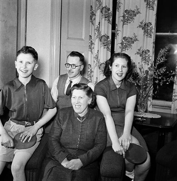 Table Tennis Family pose with bats February 1953 D707
