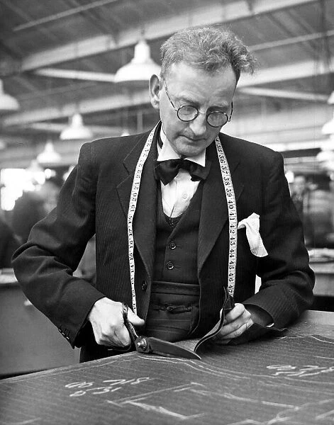 Tailor, busy at work in his workshop, 18th March 1947