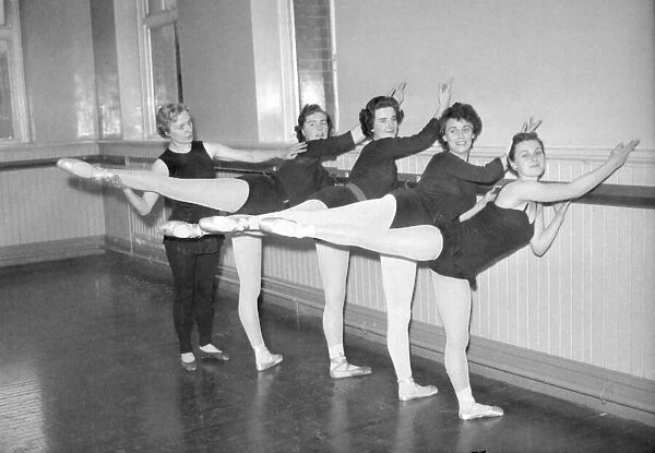 Taking a class of ballet students at the 'barre'is Miss M L Waterman