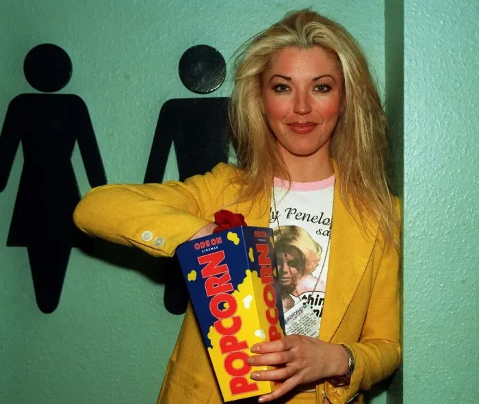 Framed Print : Tamara Beckwith model eating popcorn at film premiere circa May 1997