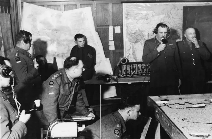 Framed Print : Tank commanders talking on radio telephones as part of a table-top exercise with model Framed Print : Tank commanders talking on radio telephones as part of a table-top exercise with model