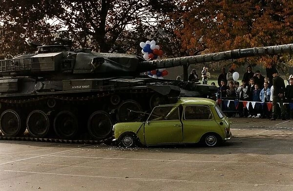 Tank running over Mr Beans green mini