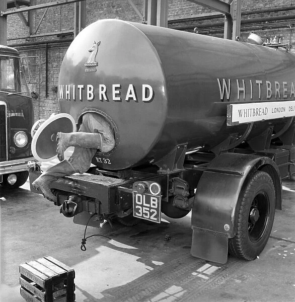 A tanker driver seen here cleaning out the inside of his vehicle at the Whitbread brewery