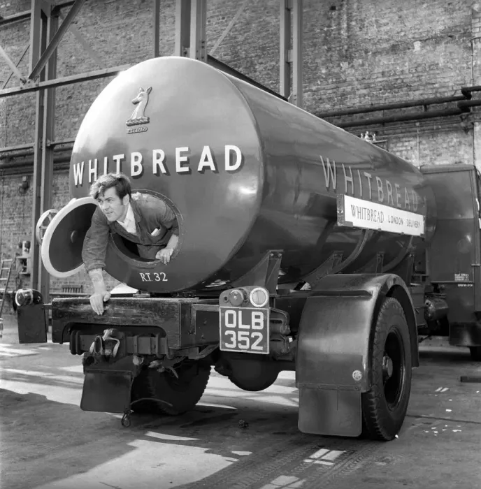 Framed Print : A tanker driver seen here cleaning out the inside of his vehicle at the Whitbread brewery Framed Print : A tanker driver seen here cleaning out the inside of his vehicle at the Whitbread brewery
