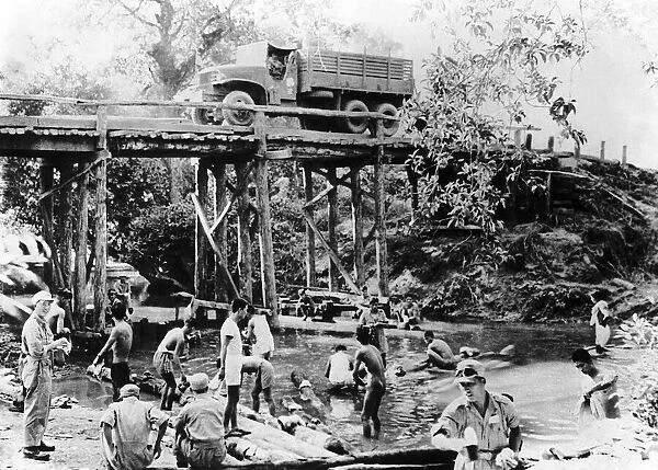Tankmen of an Armoured Corps operating in the Bhamo area of North Burma take time out to