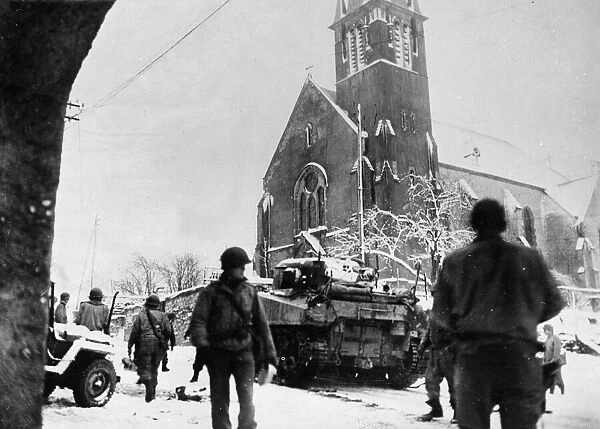 Tanks of the United States 35th Infantry Division moving through the Belgian town of