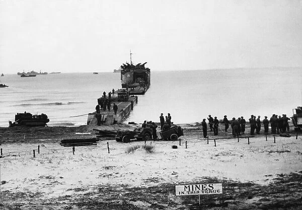 Tanks unloading from a landing craft at Nettuno. 5th February 1944