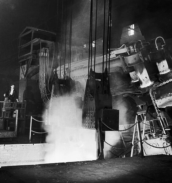 Tapping molten steel from a 30 ton electric arc furnace at the English Steel Corporation