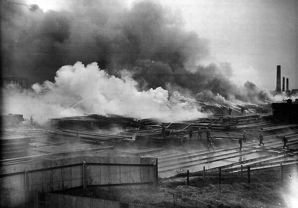 A tar fire caused by a raid over a south of England town. February 1941