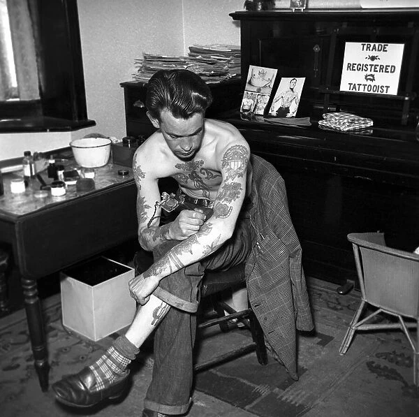 Tattoo artist D. A. Deller seen here at work in his St. Leonards Studio