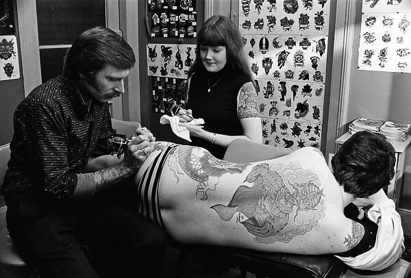 Tattooist George Bone at work. March 1977