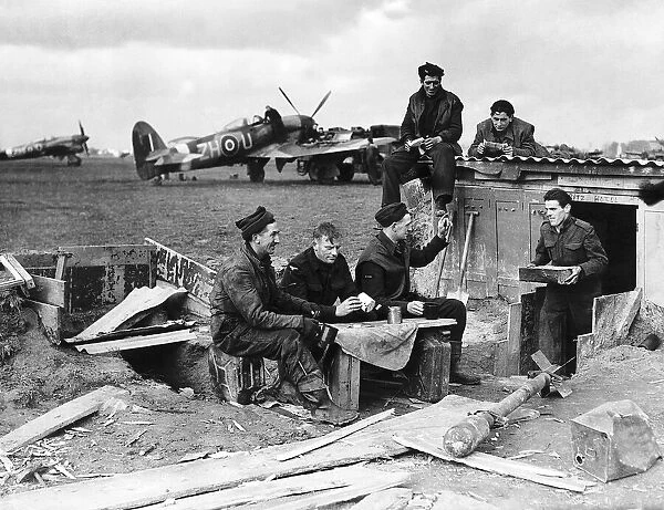 Tea break for RAF aircraft maintenance crew servicing Hawker Typhoon aircraft at their