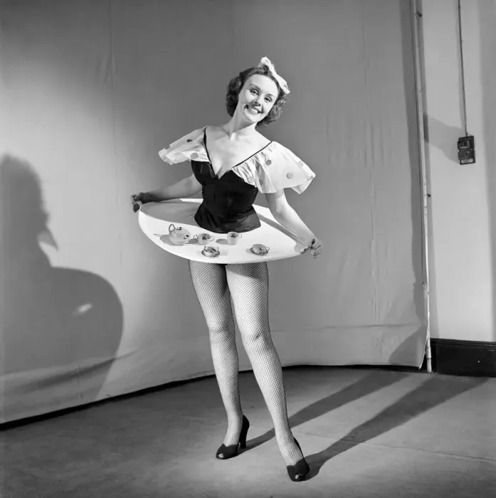 Framed Print : Tea for two: Clothing: Fashion: Skirt: Woman wearing skirt containing tea service