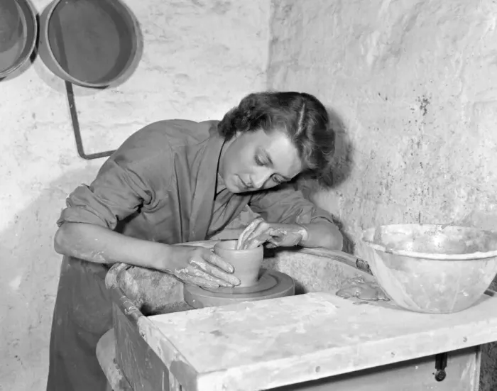Framed Print : Teacher Training College Intent on her potters wheel