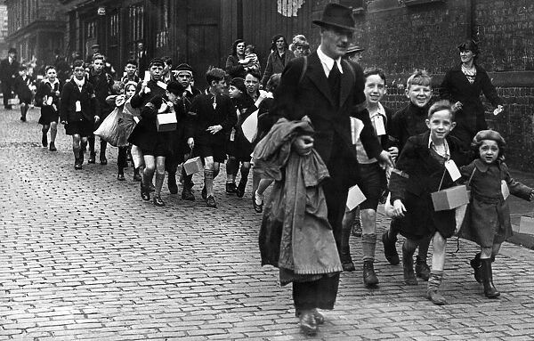 Teachers accompany a large crowd of pupils of a liverpool inner city school to