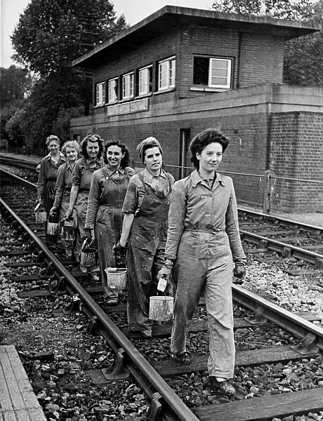 A team of girl painters employed by the Southern Division of the Southern Railway have