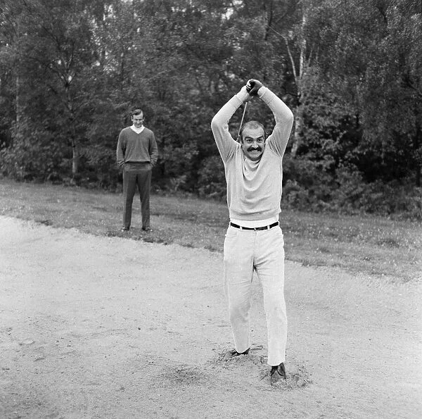 Ted Dexter and Sean Connery playing golf at Coombe Hill Golf course. 25th October 1968