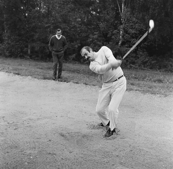 Ted Dexter and Sean Connery playing golf at Coombe Hill Golf course. 25th October 1968