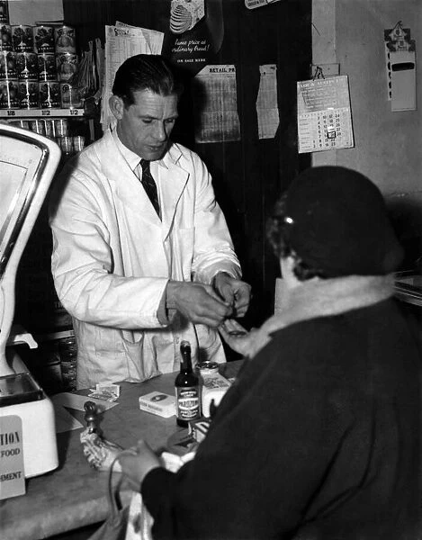 Ted Ditchburn Tottenham Hotspur footballer photographed in his grocers shop