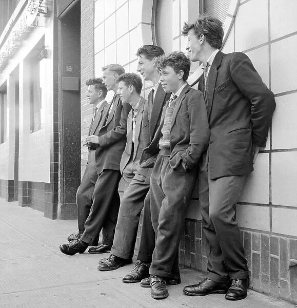 Teenage boys seen here leaning against the wall of the local coffee bar in Govan, Glasgow