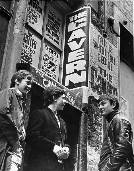 Teenage music fans talk together in Matthew Street, Liverpool