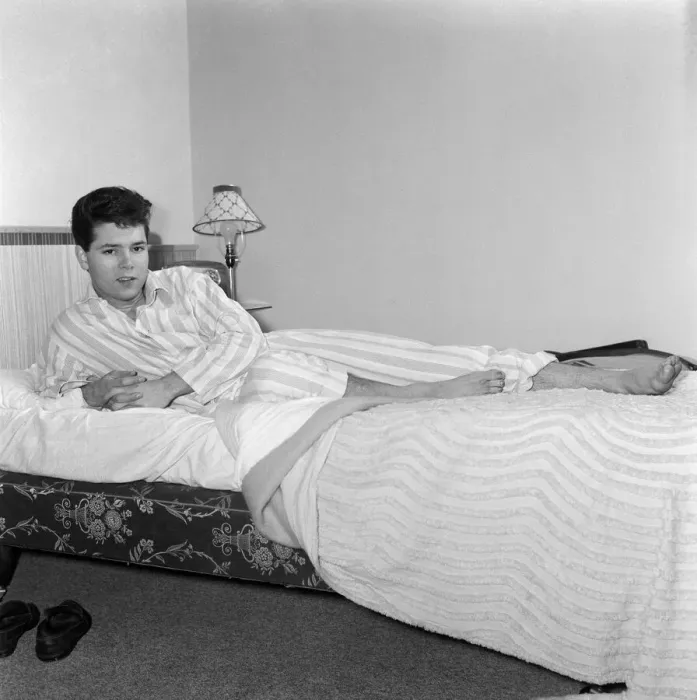 Framed Print : Teenage pop idol Cliff Richard relaxes on his divan at his Winchmore Hill home Framed Print : Teenage pop idol Cliff Richard relaxes on his divan at his Winchmore Hill home