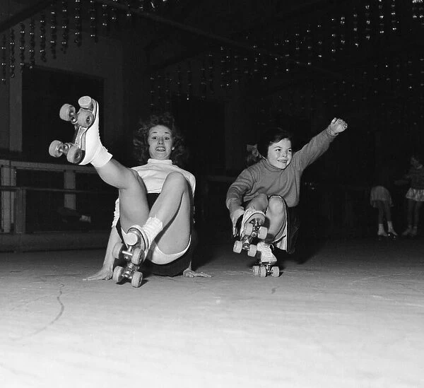 Teenager Betty Jones pictured roller skating with seven year old Anne Morgan at the rink