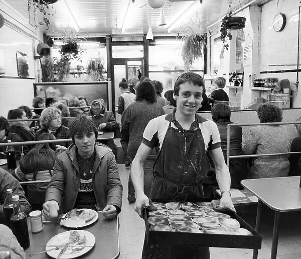 Teenager mark Orton serving food at Kellys pie and mash shop in Roman Road