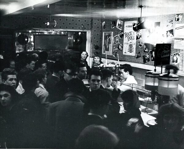 Teenagers in busy coffee bar in late 1950s Teenage young people Cafe