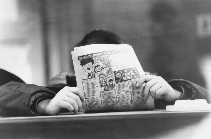 Framed Print : Teenagers enjoy the social side of a Youth Club, chatting and reading