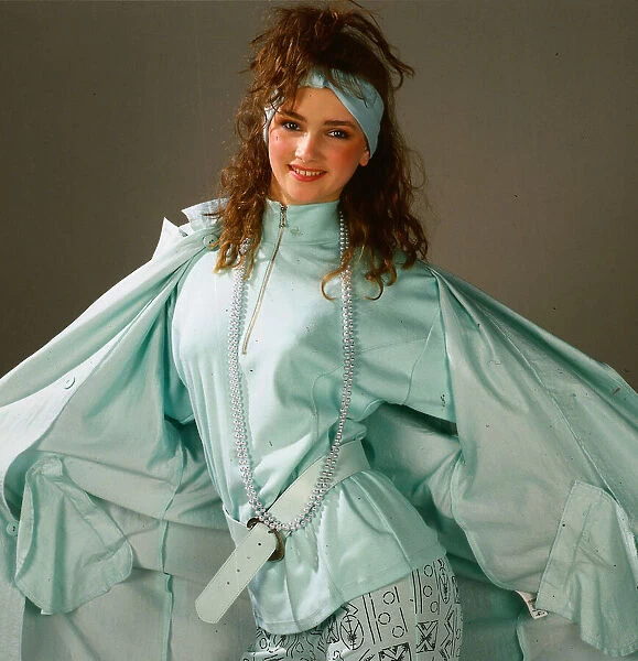 Teenagers fashion, April 1987 Model wearing lime green raincoat, top and leggings