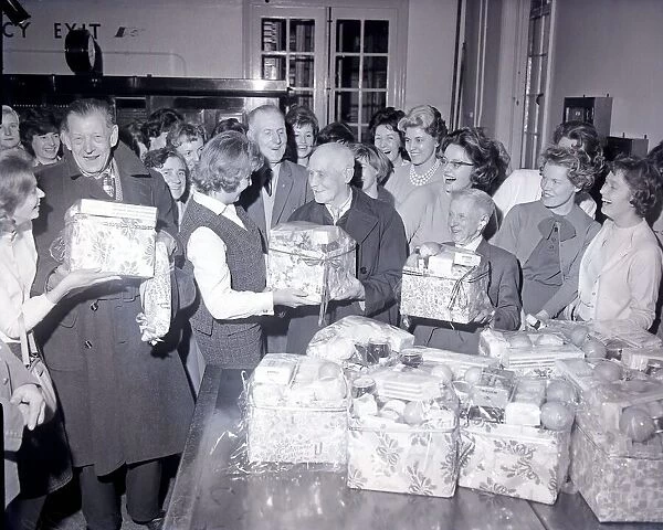 Telephonists at Coventry Telephone Exchange presenting Christmas food parcels to 13