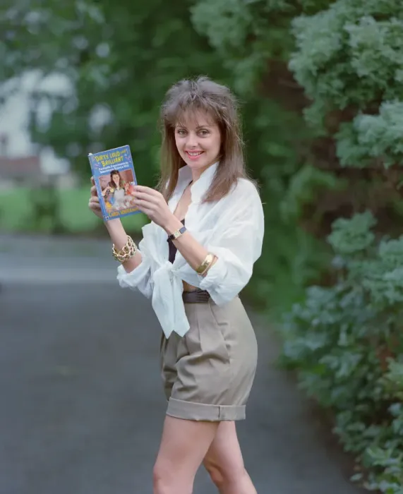 Framed Print : Television Presenter Carol Vorderman posing with her book Dirty Framed Print : Television Presenter Carol Vorderman posing with her book Dirty