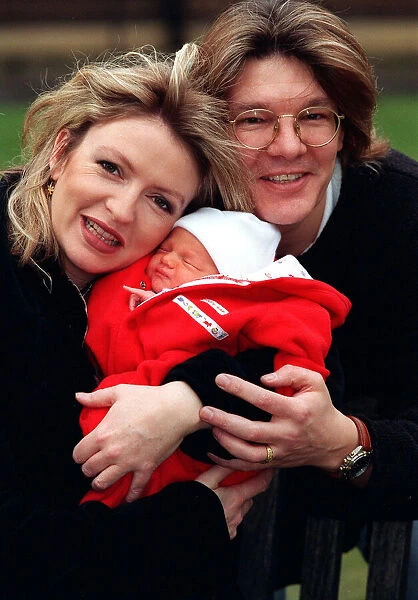 Television Presenter Caron Keating holding baby Gabriel with husband Russ Lindsay January