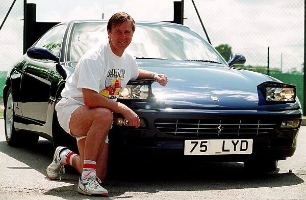 Former tennis player David Lloyd with his Ferrari sports car. 26th May 1995