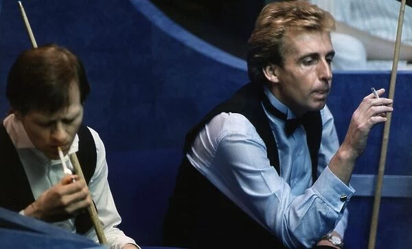 Terry Griffiths Snooker and Alex Higgins during a Snooker match both in their seats