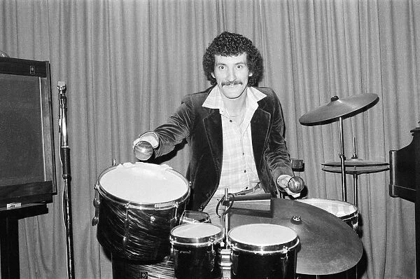 Terry McDermott, Liverpool Midfielder, is pictured having fun playing drums