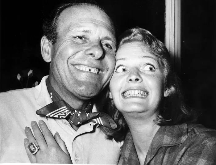 Framed Print : Terry Thomas Actor with his wife Belinda, pullung a funny face Framed Print : Terry Thomas Actor with his wife Belinda, pullung a funny face