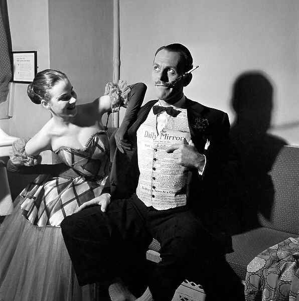 Terry Thomas tries out the Daily Mirror designed waistcoat at the Palladium Theatre where